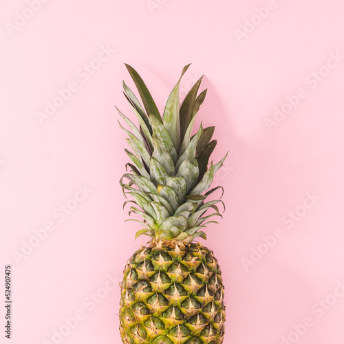 Fresh pineapple on on pastel pink background. Flat lay