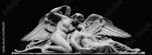 Psyche revived by Cupid's kiss. Isolated on black background. Black and white image. Horizontal image.