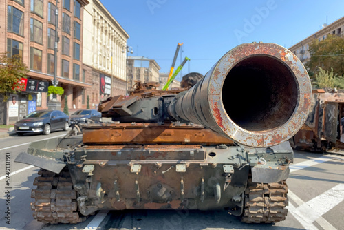 Russian battle tank knocked and destroyed during war Ukraine against Russian aggression are showing to people, on Khreshchatyk in Kyiv. Selective focus.