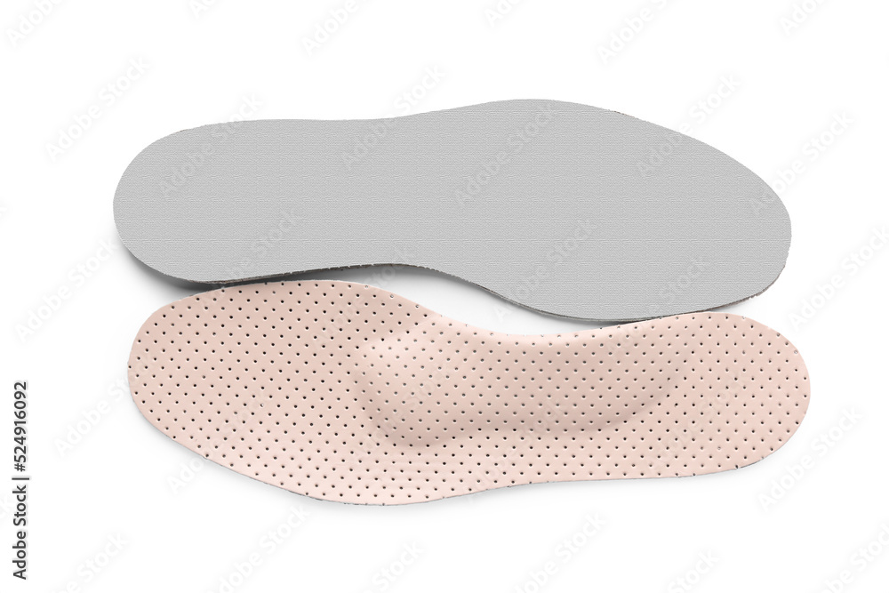 Beige orthopedic insoles isolated on white, top view Beige orthopedic insoles isolated on white, top view