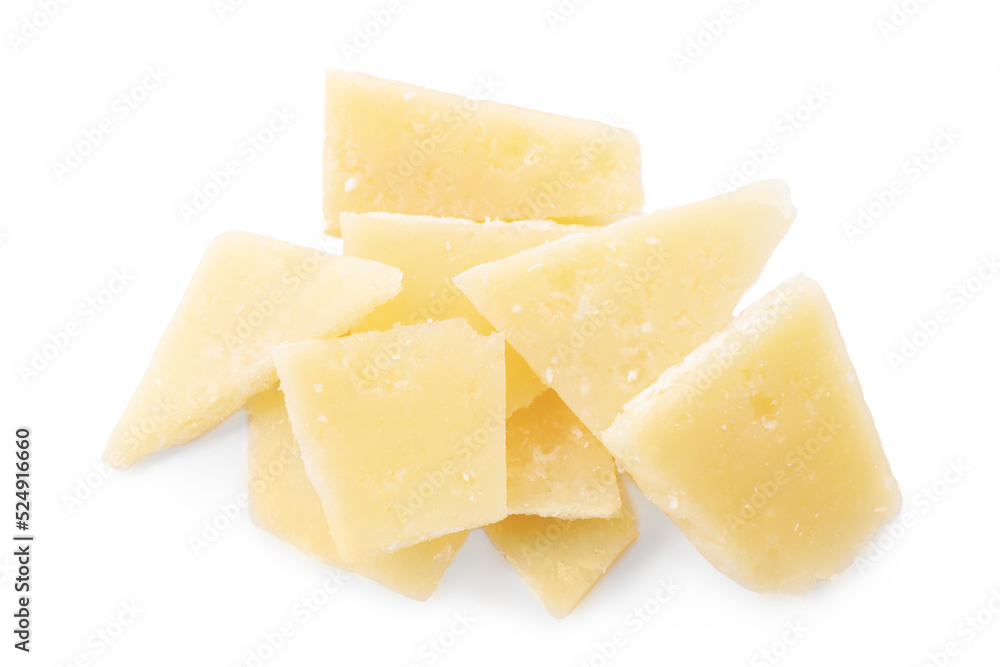 Pile of parmesan cheese pieces on white background, top view