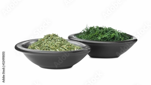 Bowls with aromatic dry and fresh dill on white background