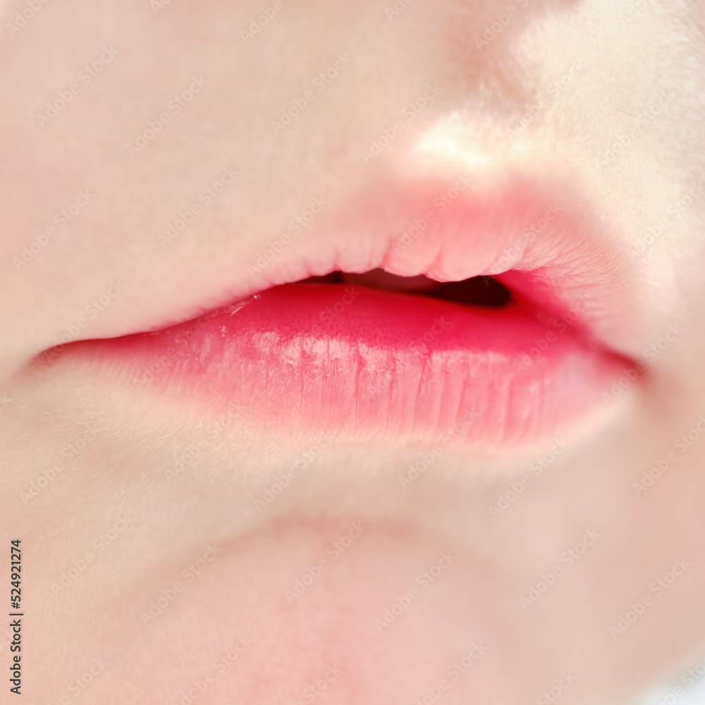 Close-up lips baby age one year, child mouth macro photo