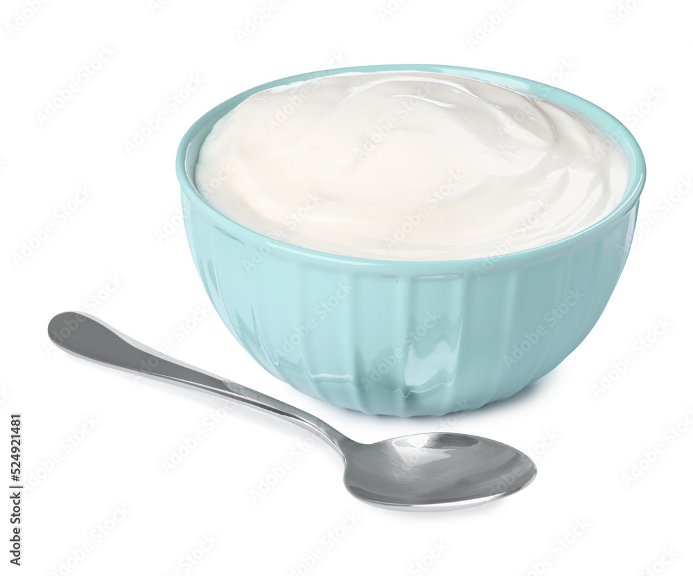 Bowl with delicious organic yogurt and spoon on white background Bowl with delicious organic yogurt and spoon on white background