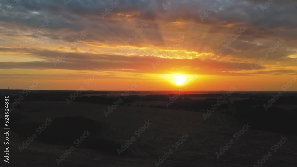 Sunset from above flying towards the sun. A shot of a drone flying in twilight at sunset Sunset from above flying towards the sun. A shot of a drone flying in twilight at sunset