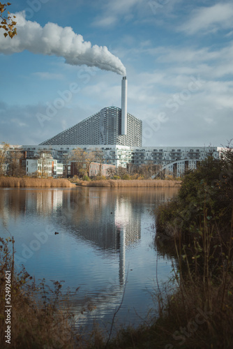 The reflection of Copenhill, which is a power plant used to convert biomass into heat and electricity. It is a way to reduce the carbon emissions. It is also the world building of the year 2021.  photo