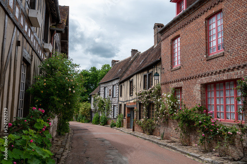 One of most beautiful french villages, Gerberoy - small historical village with half-timbered houses and colorful roses flowers, France © barmalini