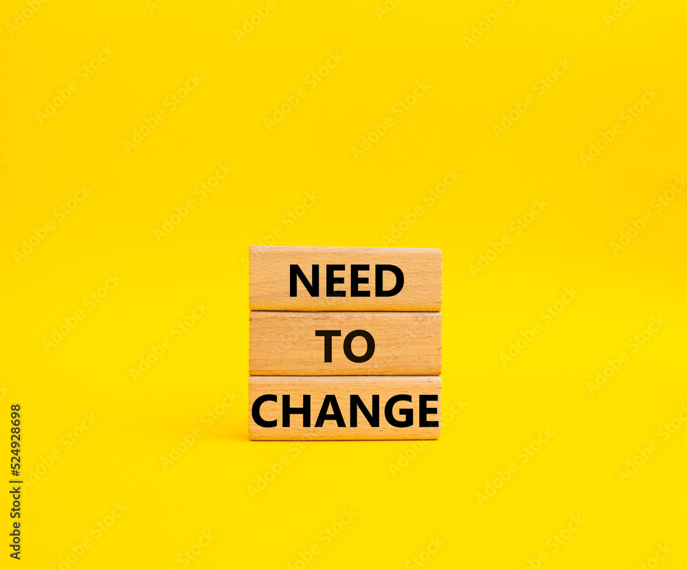 Need to change symbol. Concept words 'Need to change' on wooden blocks. Beautiful yellow background. Business and Need to change concept. Copy space. Need to change symbol. Concept words 'Need to change' on wooden blocks. Beautiful yellow background. Business and Need to change concept. Copy space.