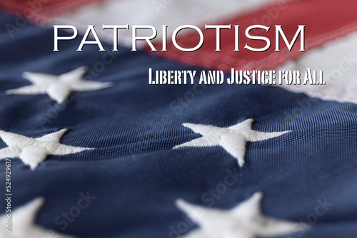 Patriotism - Liberty and Justice For All framed against an American Flag. photo