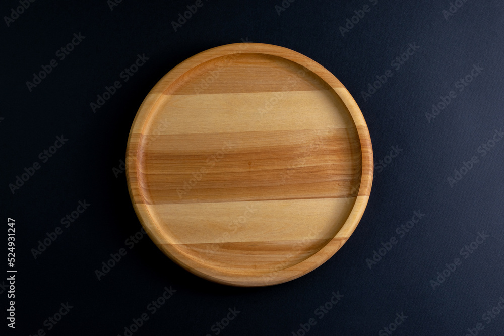 a circle wooden food stand on a dark background top view a circle wooden food stand on a dark background top view