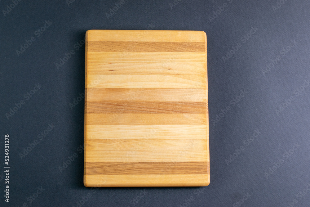 a rectangular wooden food stand on a dark background top view