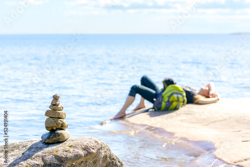 Pyramid of stones. Unstable balance of stone objects. Idyllic state of nature.