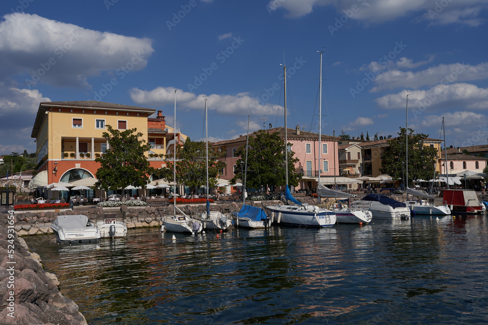 Bardolino, Italy - July 11, 2022 - Cisano - the small boat harbor on a summer afternoon       