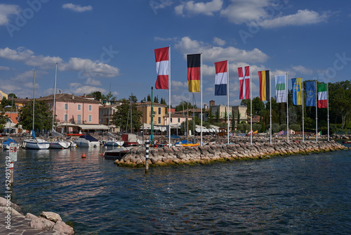 Bardolino, Italy - July 11, 2022 - Cisano - the small boat harbor on a summer afternoon        photo