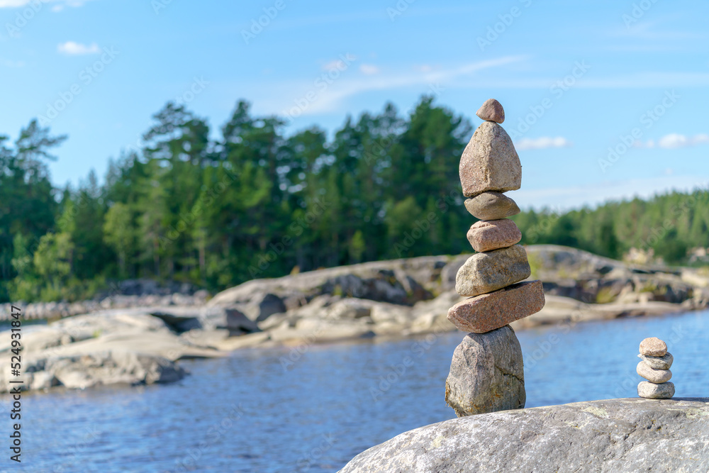 Pyramid of stones. Unstable balance of stone objects. Idyllic state of nature.