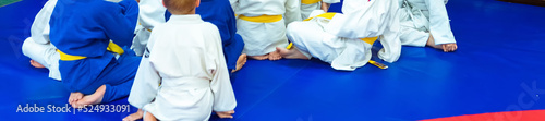 Judo - wrestling, tatami for wrestling, children of sports, legs on a bright colored tatami