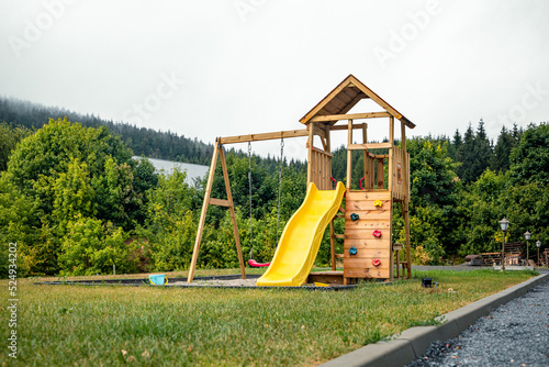 New empty wooden kids climbing frame in nature