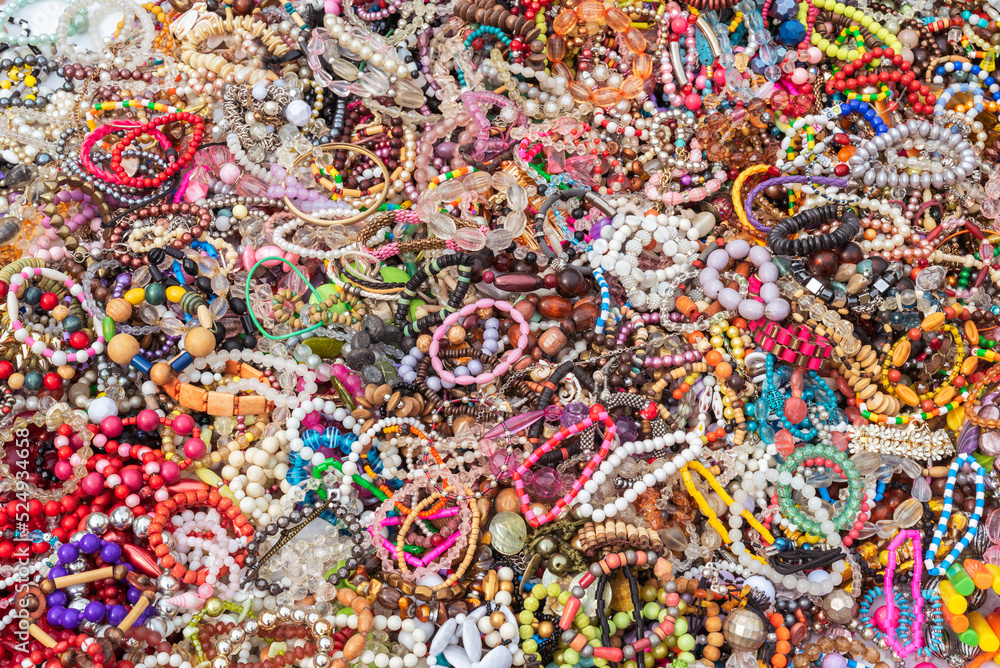 Colorful bracelets, beads, accessories and souvenirs on street market