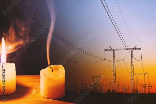 Bild auf Leinwand Burning flame and extinguished candle and power lines on background