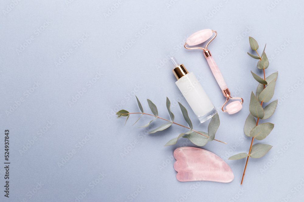 Gua sha jade roller for face massage, anti-aging treatment, flat lay with copy space Gua sha jade roller for face massage, anti-aging treatment, flat lay with copy space