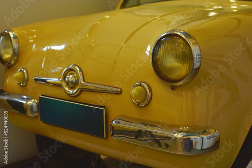 Fragment of a yellow retro car