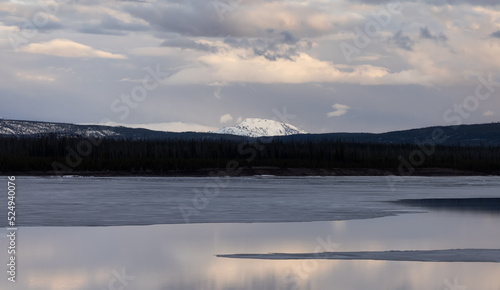 View of a frozen Yellowstone Lake with snow covered mountains in American Landscape. Yellowstone National Park. United States. Nature Background.