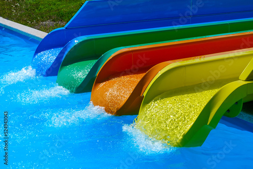 Colorful slides in the water park in summer photo