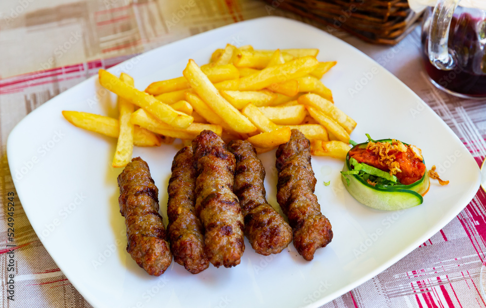 Cevapcici with french fries. Balkan cuisine