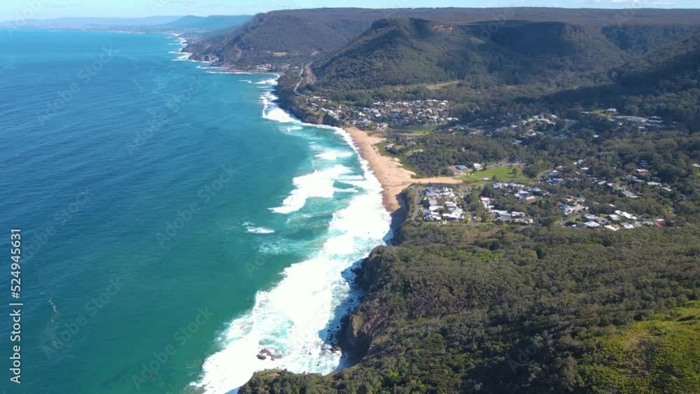 Aerial drone view of the coast of Stanwell Tops between the cities of Sydney and Wollongong on the New South Wales, Australia coastline, heading south toward Bald Hill Lookout and Stanwell Park Beach Aerial drone view of the coast of Stanwell Tops between the cities of Sydney and Wollongong on the New South Wales, Australia coastline, heading south toward Bald Hill Lookout and Stanwell Park Beach