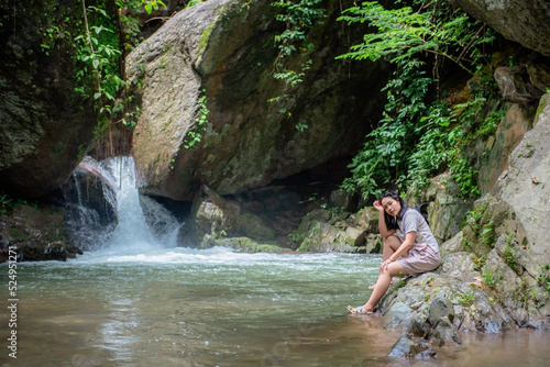 A vacation to a waterfall in the middle of the forest in the high valley.