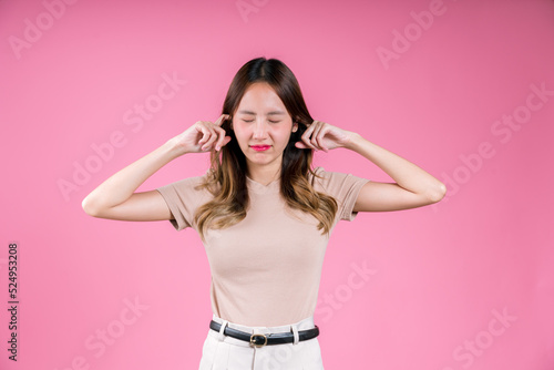 Wallpaper Mural Asian woman finger covering your ear to mute loud noise her unhappy sound expres