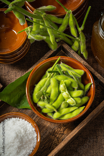 Fresh edamame on a wooden plate