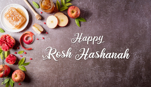 Rosh hashanah (Jewish New Year holiday), Concept of traditional or religion symbols on dark stone background. photo