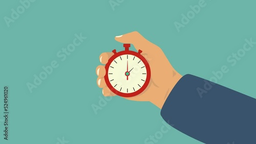 A hand pressing down the button on a timer