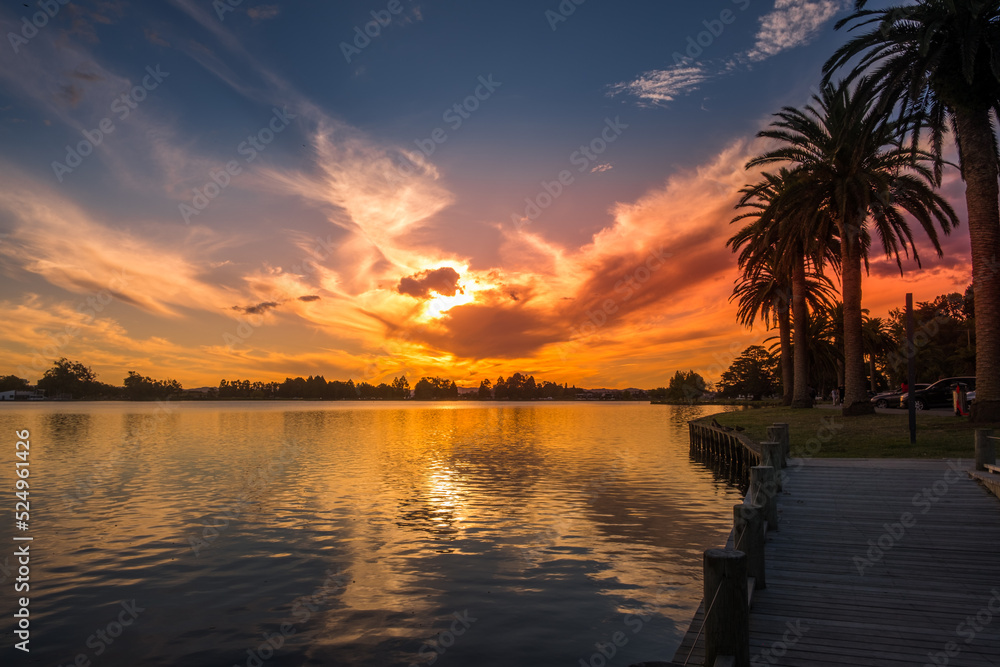 Sunset reflections at Hamilton's Rotoroa Lake in New Zealand
