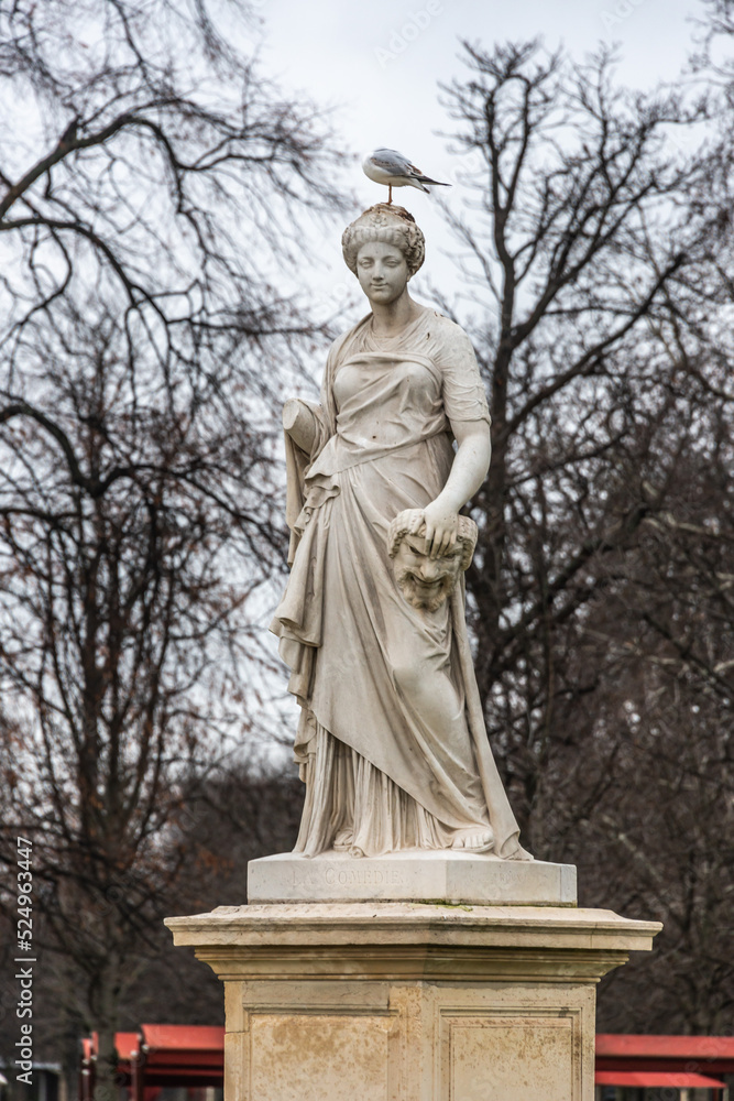 statue of Demeter marble in france park in autum