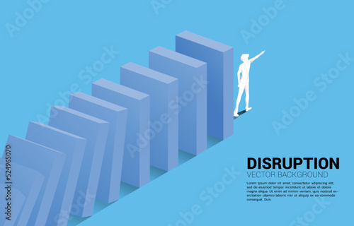 Silhouette of businessman point forward at the end of domino collapse. Concept of business industry disrupt