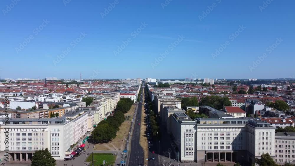 In the flow of traffic, no clouds.Tranquil aerial view flight passing close drone footageof berlin Frankfurter Tor turret tower at sunny summer day 2022 In the flow of traffic, no clouds.Tranquil aerial view flight passing close drone footageof berlin Frankfurter Tor turret tower at sunny summer day 2022