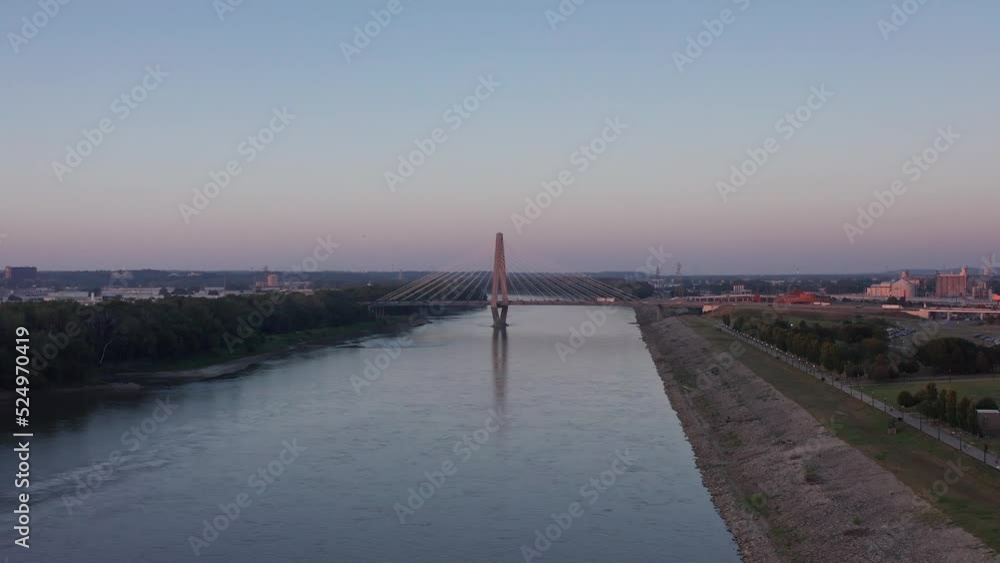 Low wide aerial shot of the New Paseo Bridge across the Missouri River in Kansas City at sunset. 4K Low wide aerial shot of the New Paseo Bridge across the Missouri River in Kansas City at sunset. 4K