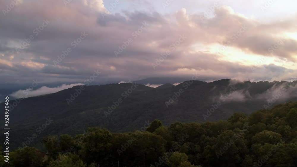 aerial push over mountain ridge toward clouds at sunset near blowing rock nc aerial push over mountain ridge toward clouds at sunset near blowing rock nc