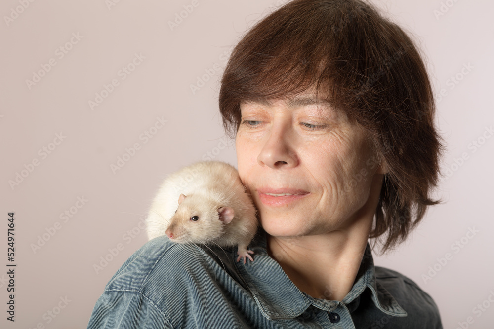 woman with a white domestic rat woman with a white domestic rat