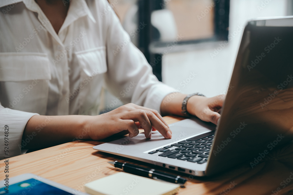 Asian businesswoman working with laptop at office. Asian businesswoman working with laptop at office.