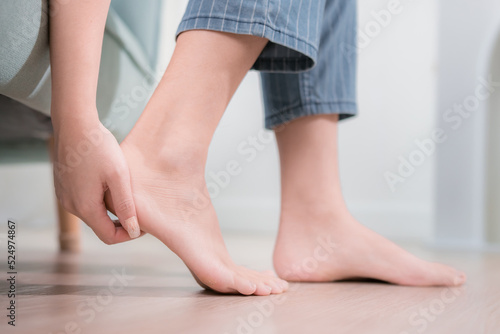Asian women are using foot creams lotion to treat cracked heels. © Kiattisak