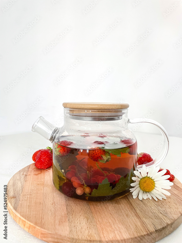 teapot with wooden lid on white background, berry tea teapot with wooden lid on white background, berry tea