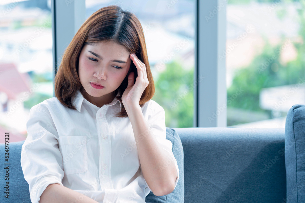 Tension stress asian women headache have migraine touching her temples feeling stress upset depressed. Strong headache migraine exhausted girl can't sleep. Office syndrome unhealthy person. Tension stress asian women headache have migraine touching her temples feeling stress upset depressed. Strong headache migraine exhausted girl can't sleep. Office syndrome unhealthy person.