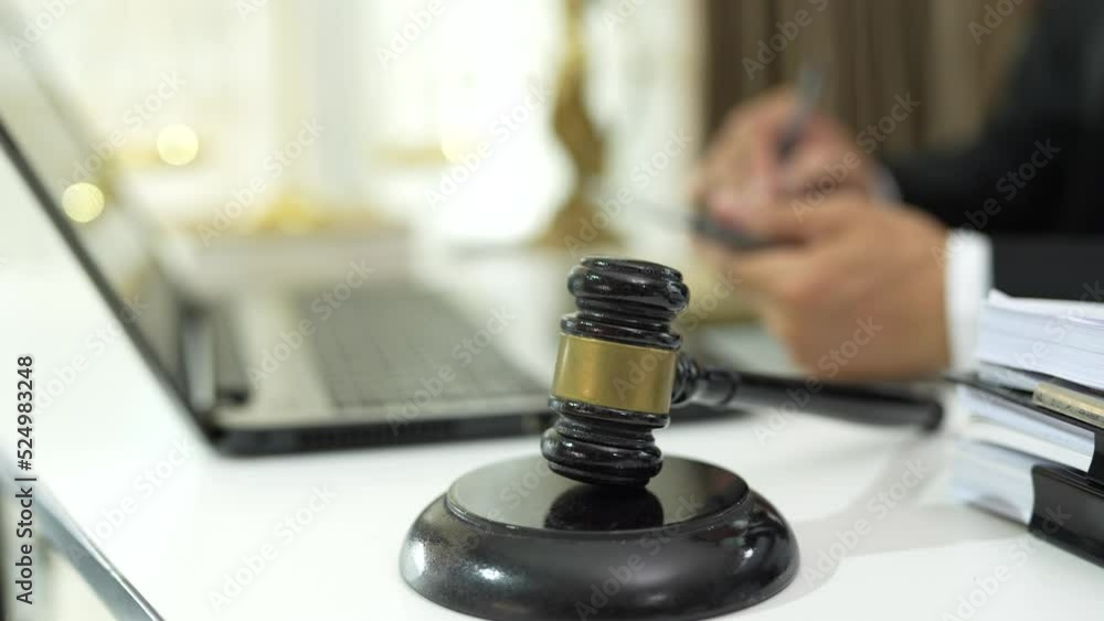 Consult Judge or lawyer Hand Writing Document in Court Room. Consult Judge or lawyer Hand Writing Document in Court Room.