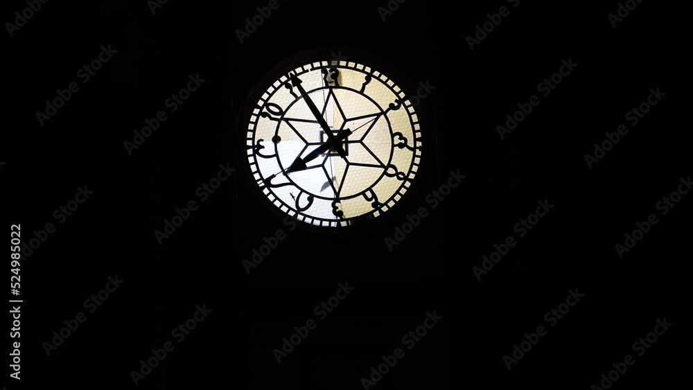 clock tower image in dark background.