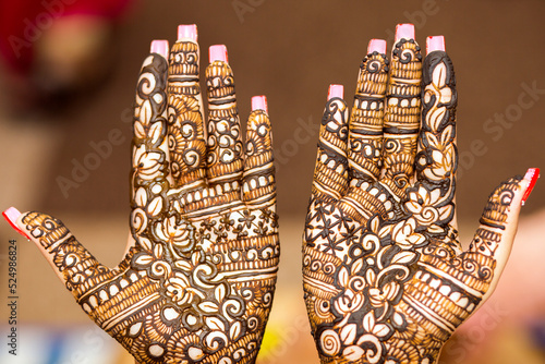 mehndi design on Indian bride's palm on her wedding eve. photo