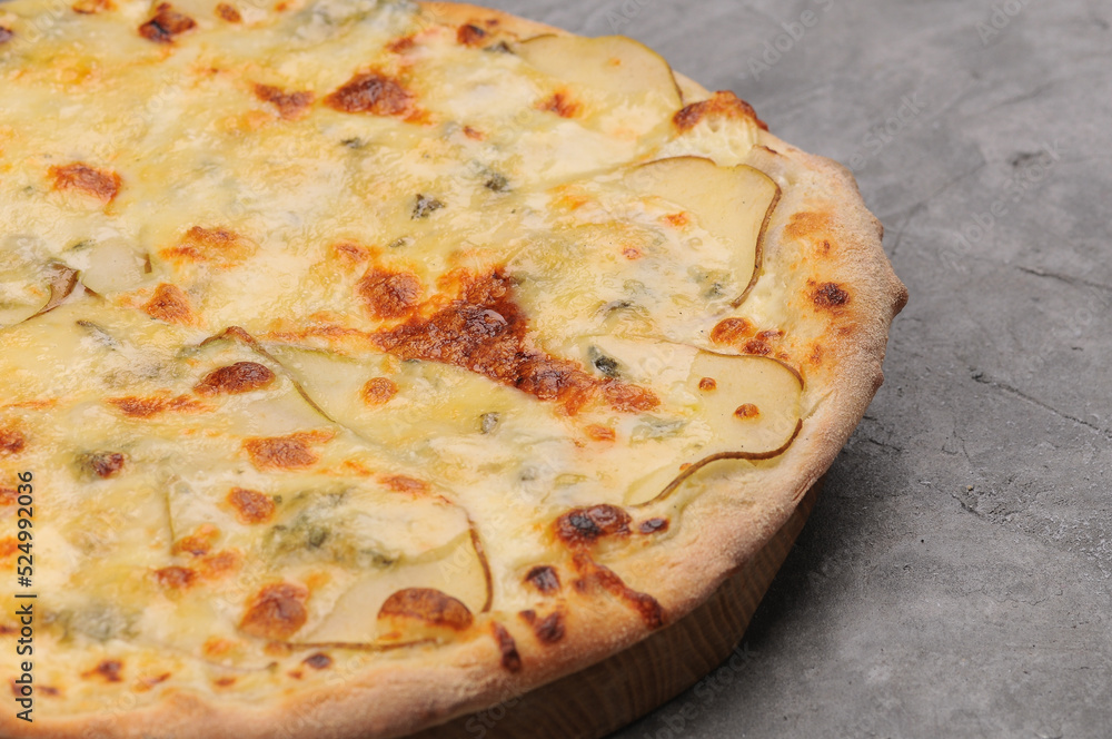 pizza crust and cheese with side dish on a gray background macro photo
pizza crust and cheese with side dish on a gray background macro photo
