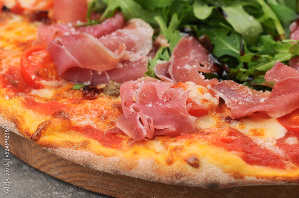 pizza with ham arugula and cheese macro photo
